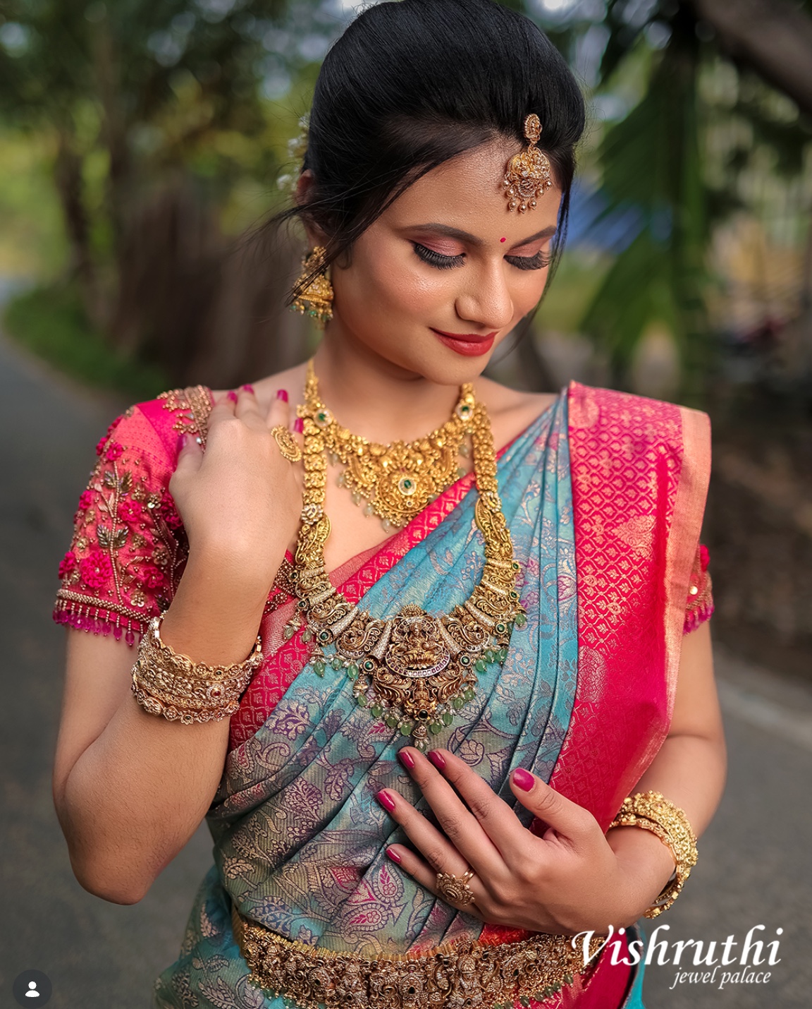 Exquisite hand-embroidered bridal blouse with Lord Lakshmi temple arch and jewellery by Harsa Designer Boutique Coimbatore